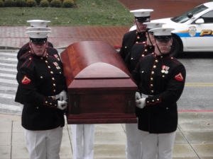 Marine Corps body bearers carry the coffin of Moline Ripley up the front steps of the Naval Academy Chapel in Annapolis Maryland. 