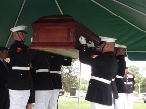 Marine Corps body bearers raising the coffin of Moline Ripley before the final blessings. "Vaunted on high" as Colonel John Ripley would have wanted it.  